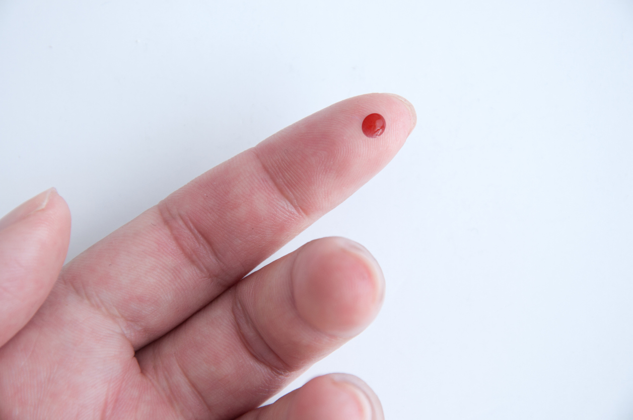 Blood spot collection card from a finger prick